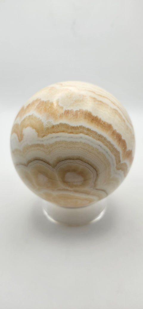Orange calcite sphere. 72.5mm, 2.85 inches, 1.3 pounds