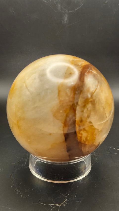 Ferruginous quartz sphere. 71.6mm, 2.82 inches, 1.2 pounds