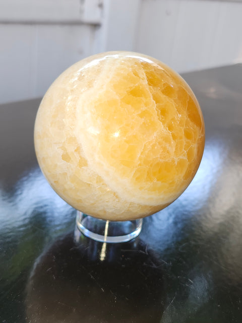 Orange calcite sphere! 73.6mm, 2.9 inches, 1.4 pounds