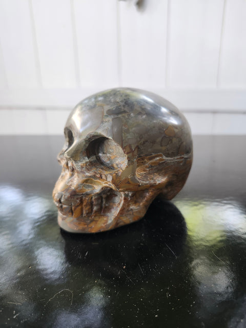 Fruit jasper skull, 1.3 pounds, 3.75 inches long, 3 inches tall, 2.5 inches wide