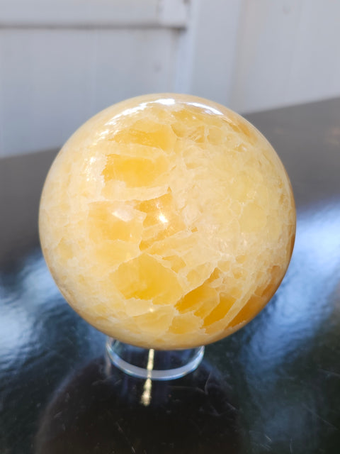 Orange calcite sphere! 73.6mm, 2.9 inches, 1.4 pounds