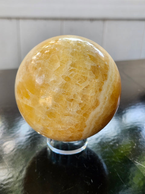 Orange calcite sphere! 73.6mm, 2.9 inches, 1.4 pounds