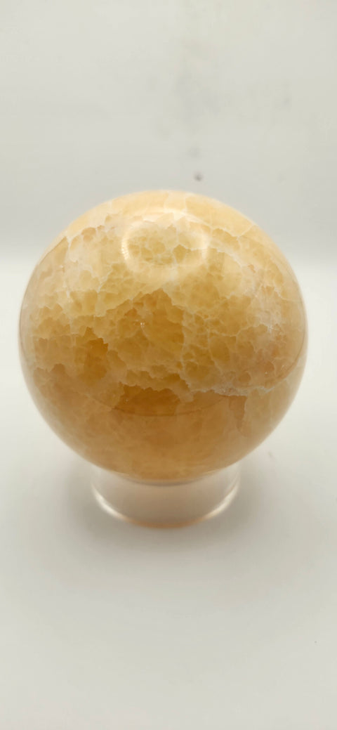 Orange calcite sphere. 72mm, 2.83 inches, 1.3 pounds!