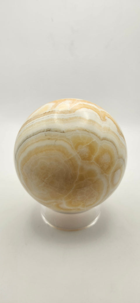 Orange calcite sphere. 72.5mm, 2.85 inches, 1.3 pounds