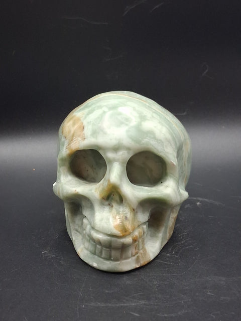 Green calcite skull! 1.4 pounds, 3.5 inches long, 2.7 inches tall