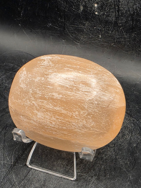 Peach selenite palm stone! 2.5 inches wide, 3 ounces