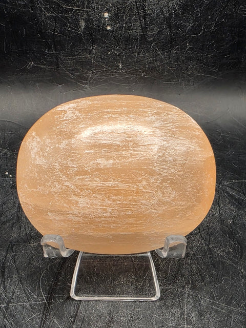 Peach selenite palm stone! 2.5 inches wide, 3 ounces