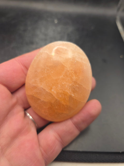 Peach selenite palm stone! 2.4 inches wide!