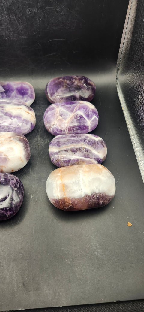 Dream amethyst palm stone! 2 too 4 ounces 2 inches long, 1.5 wide