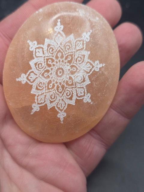 Peach selenite mandala etched palm stone! 2.5 inches wide