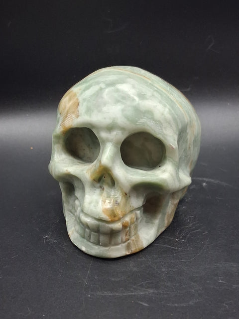 Green calcite skull! 1.4 pounds, 3.5 inches long, 2.7 inches tall