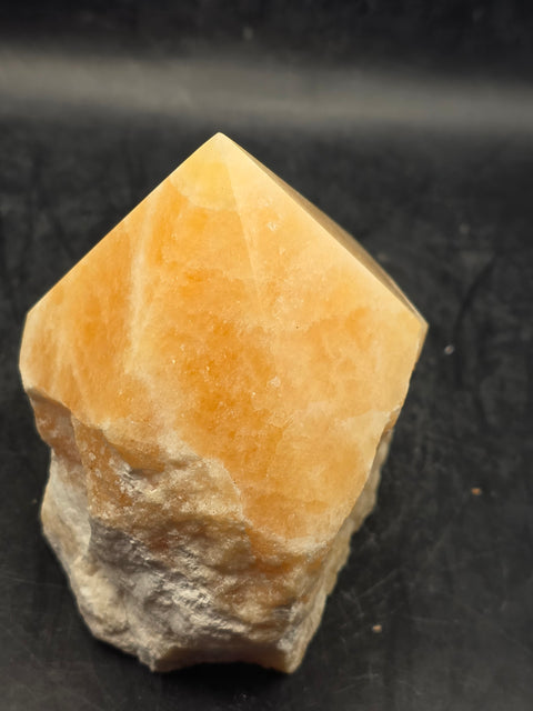 Orange calcite polished top point! 1 pound, 3.1 inches tall, 2.7 inches wide