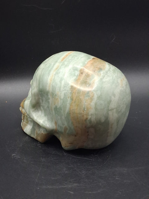 Green calcite skull! 1.4 pounds, 3.5 inches long, 2.7 inches tall