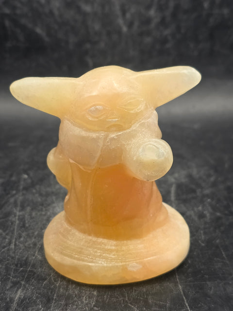 Orange calcite yoda! 4.4 ounces, 2.4 inches tall