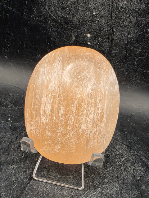 Peach selenite palm stone! 2.5 inches wide, 3 ounces