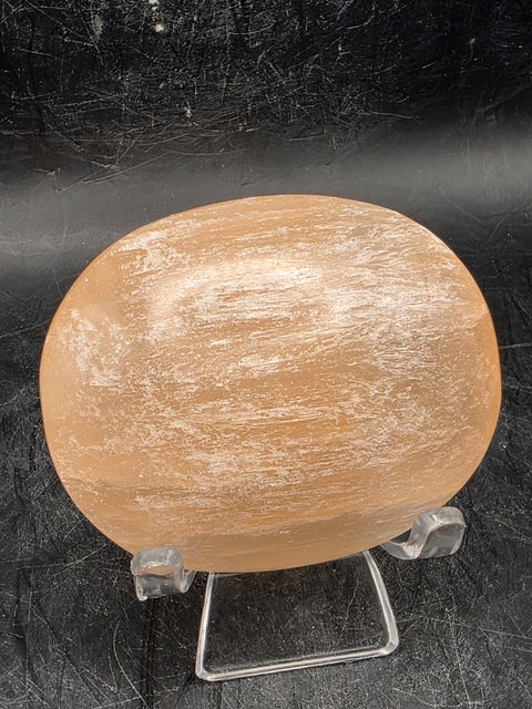 Peach selenite palm stone! 2.5 inches wide, 3 ounces