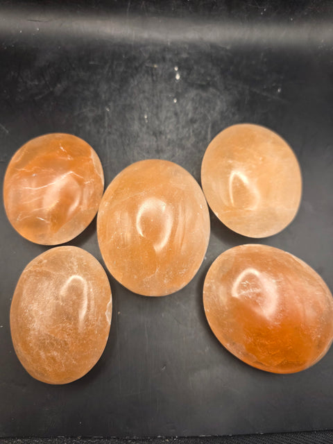 Peach selenite palm stone! 2.4 inches wide!