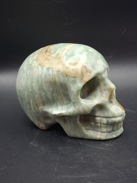 Green calcite skull! 1.4 pounds, 3.5 inches long, 2.7 inches tall
