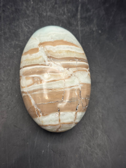 Caribbean calcite palm stone! 4.1 ounces, 2.9 inches long, 1.8" wide