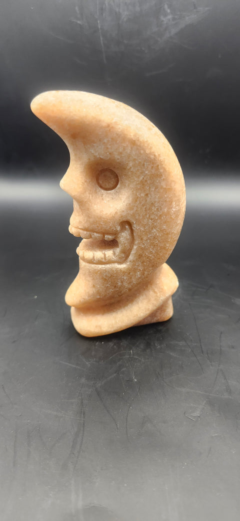 Orange calcite skull faced moon!! 7.2 ounces, 4 inches tall