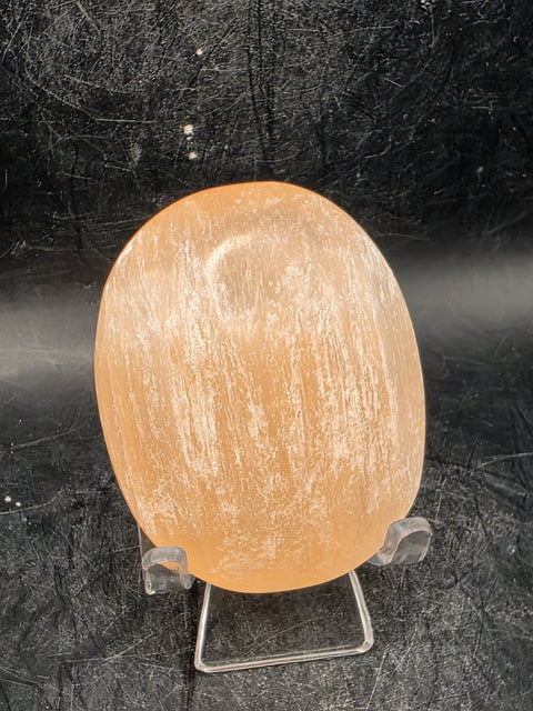 Peach selenite palm stone! 2.5 inches wide, 3 ounces