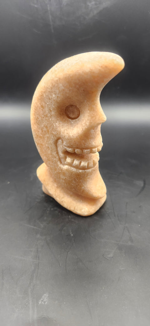 Orange calcite skull faced moon!! 7.2 ounces, 4 inches tall