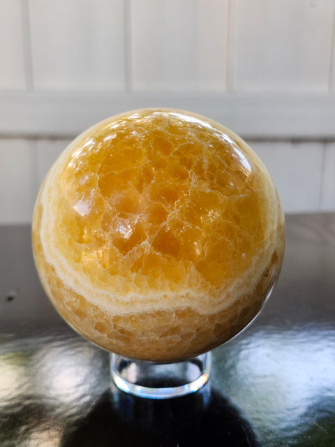 Orange calcite sphere! 73.6mm, 2.9 inches, 1.4 pounds