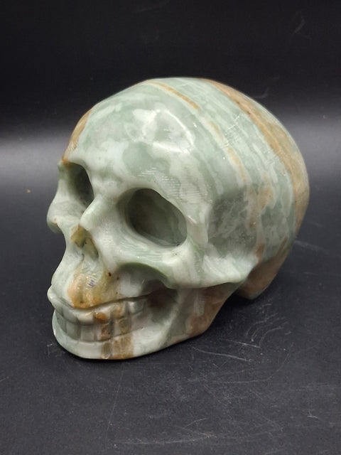 Green calcite skull! 1.4 pounds, 3.5 inches long, 2.7 inches tall