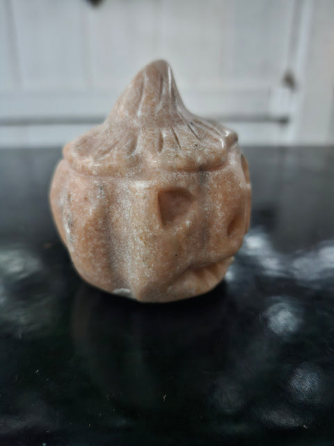 Orange calcite pumpkin. 9 ounces, 3 inches tall