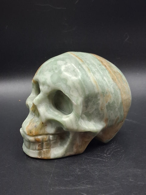 Green calcite skull! 1.4 pounds, 3.5 inches long, 2.7 inches tall
