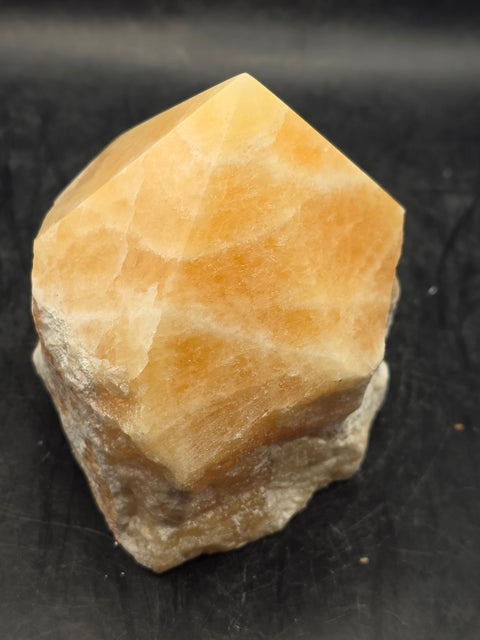 Orange calcite polished top point! 1 pound, 3.1 inches tall, 2.7 inches wide