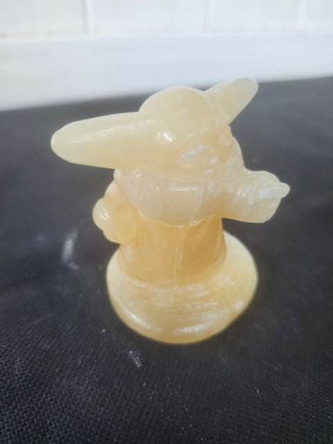 4.4 ounce, 2.75 inch orange calcite yoda