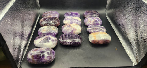 Dream amethyst palm stone! 2 too 4 ounces 2 inches long, 1.5 wide