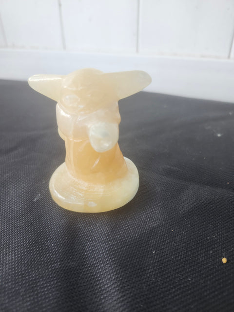 4.4 ounce, 2.75 inch orange calcite yoda