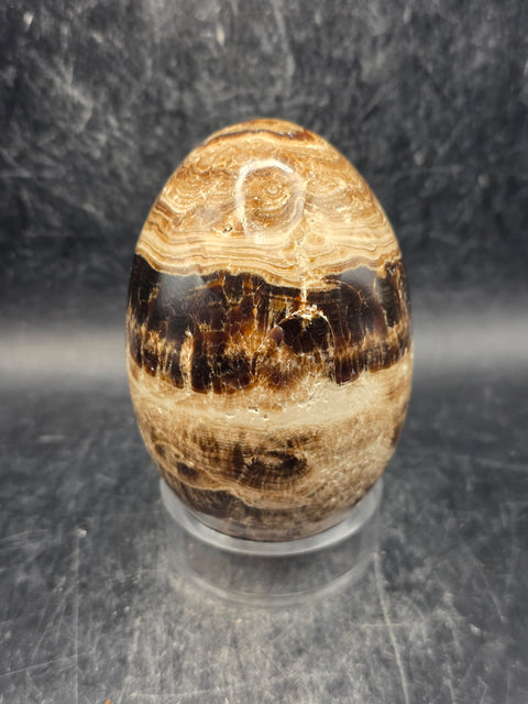 Chocolate calcite lingam! 11.8 ounces, 3.3 inches tall, 2" wide