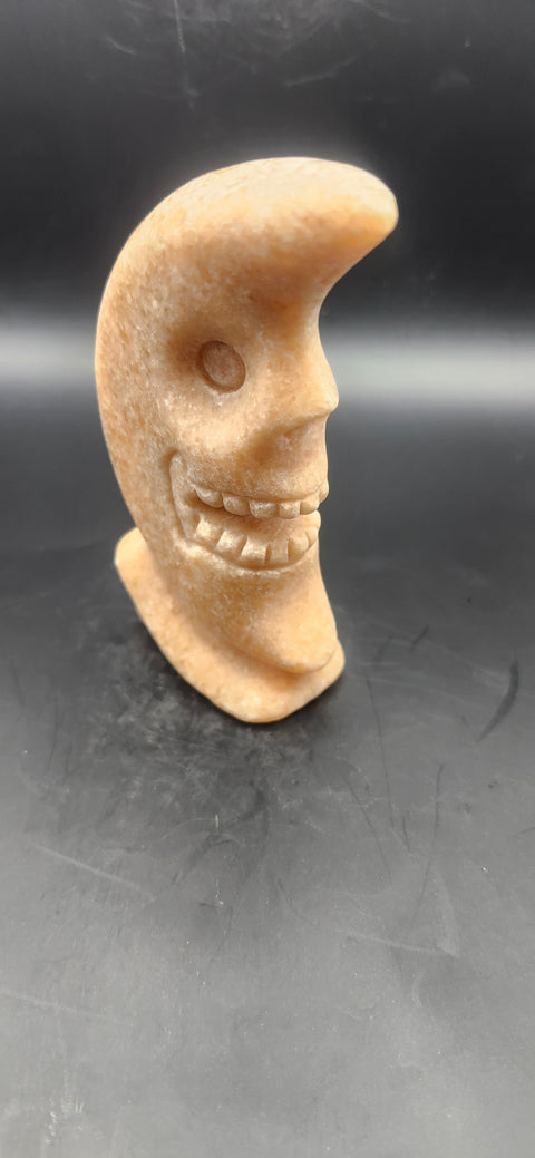 Orange calcite skull faced moon!! 7.2 ounces, 4 inches tall
