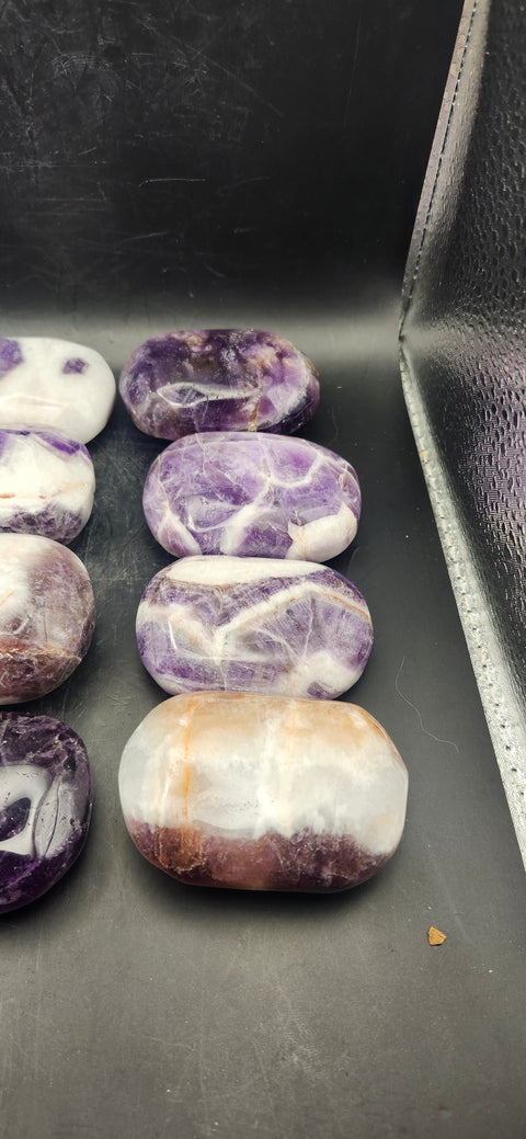 Dream amethyst palm stone! 2 too 4 ounces 2 inches long, 1.5 wide