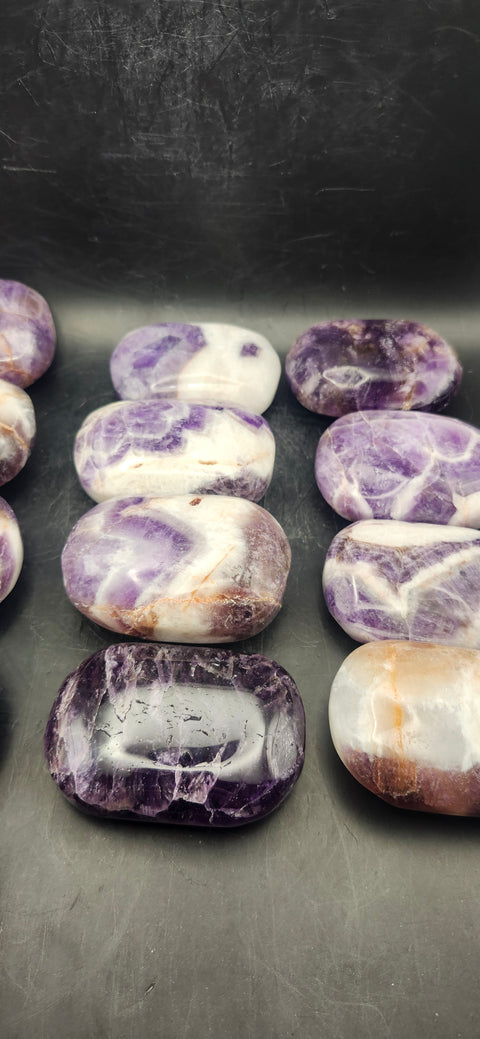 Dream amethyst palm stone! 2 too 4 ounces 2 inches long, 1.5 wide