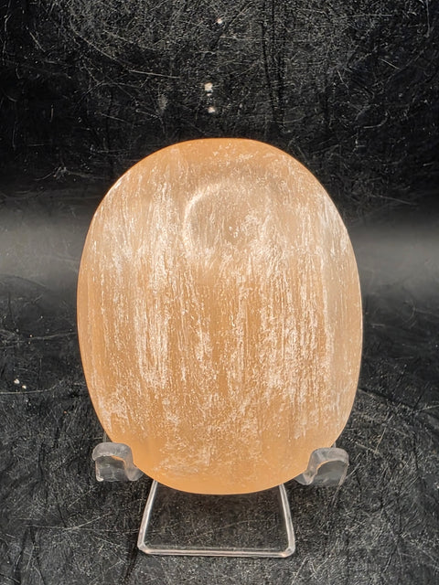 Peach selenite palm stone! 2.5 inches wide, 3 ounces