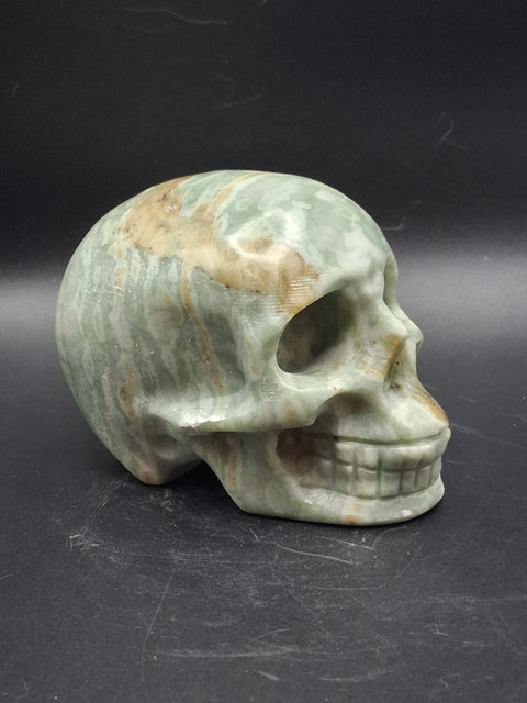 Green calcite skull! 1.4 pounds, 3.5 inches long, 2.7 inches tall