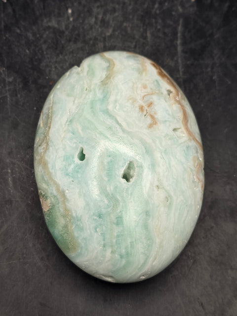 Caribbean calcite palm stone! 4.7 ounces 2.8 inches long, 2" wide