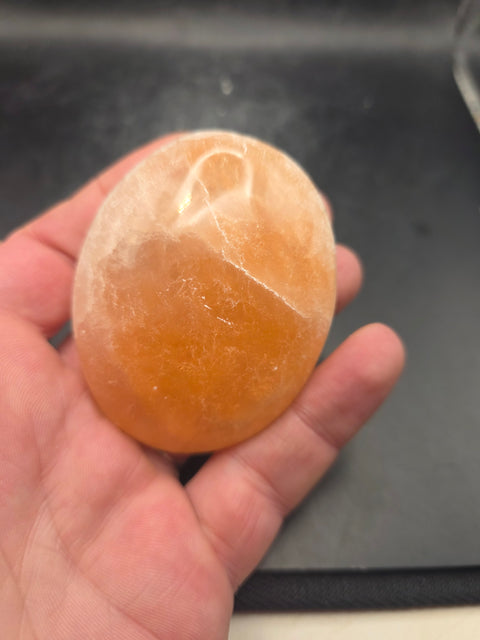 Peach selenite palm stone! 2.4 inches wide!