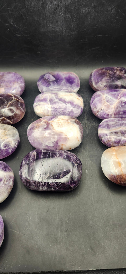 Dream amethyst palm stone! 2 too 4 ounces 2 inches long, 1.5 wide