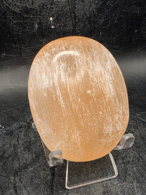 Peach selenite palm stone! 2.5 inches wide, 3 ounces