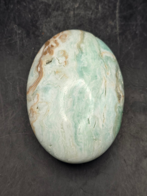 Caribbean calcite palm stone! 4.7 ounces 2.8 inches long, 2" wide