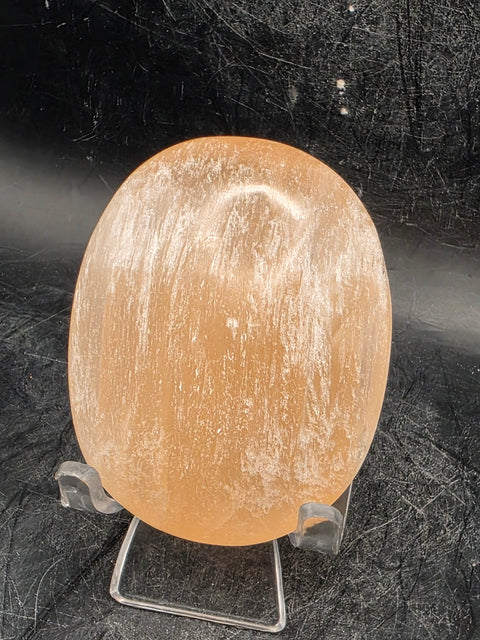 Peach selenite palm stone! 2.5 inches wide, 3 ounces
