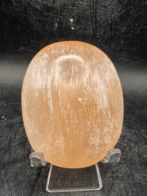 Peach selenite palm stone! 2.5 inches wide, 3 ounces