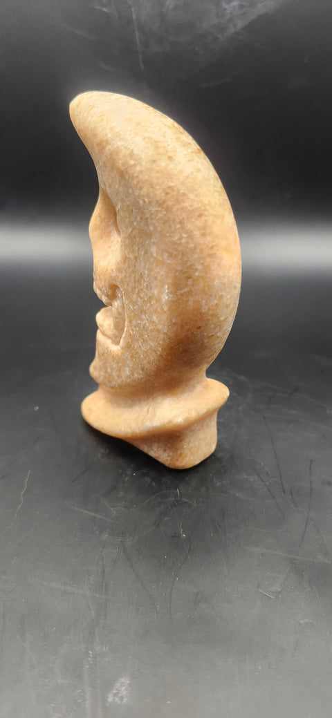 Orange calcite skull faced moon!! 7.2 ounces, 4 inches tall
