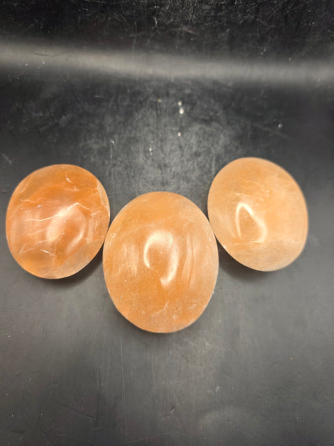 Peach selenite palm stone! 2.4 inches wide!