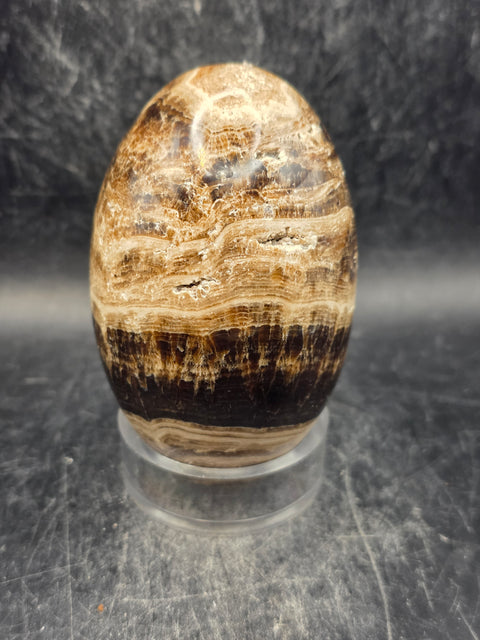 Chocolate calcite lingam! 11.8 ounces, 3.3 inches tall, 2" wide